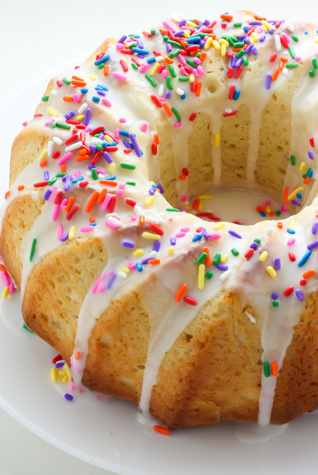 A supremely moist Vanilla Buttermilk Bundt Cake topped with a simple Vanilla Glaze and plenty of sprinkles!