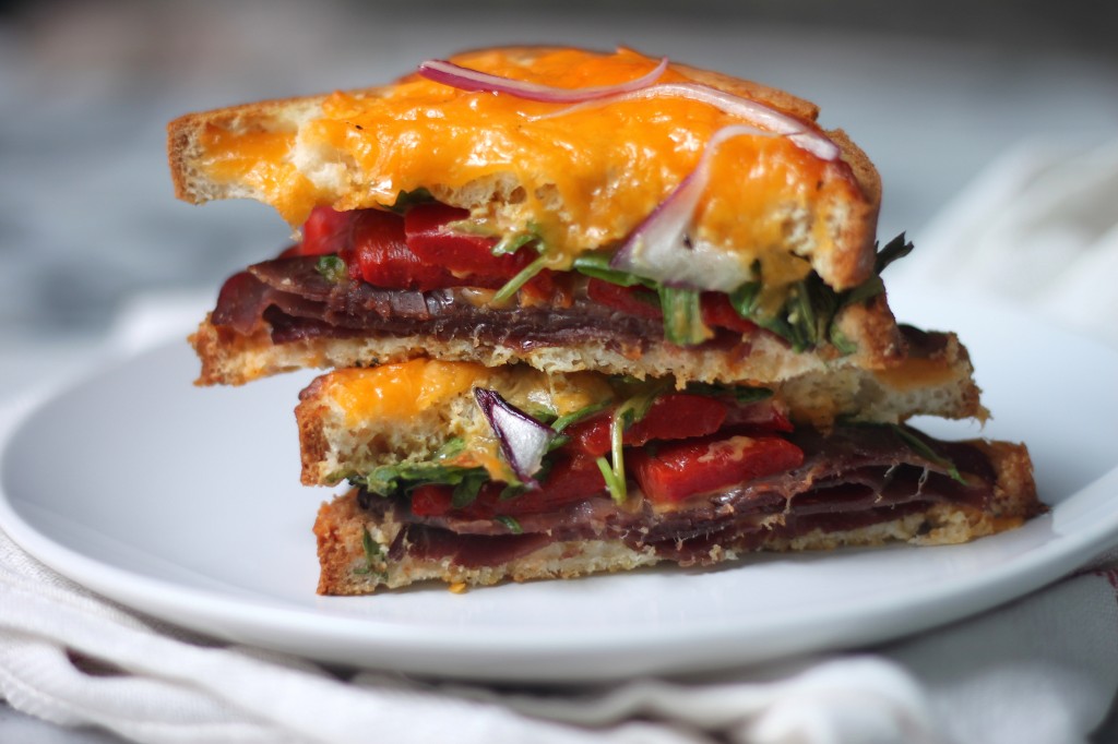 Bresaola, Arugula, and Roasted Red Pepper Cheddar Melts