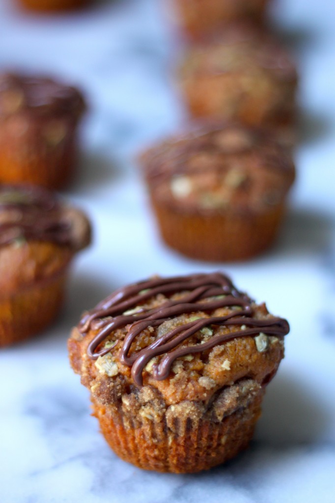 Pumpkin Banana Olive Oil Muffins with Crystalized Ginger Pepita Crumble and Nutella Drizzle