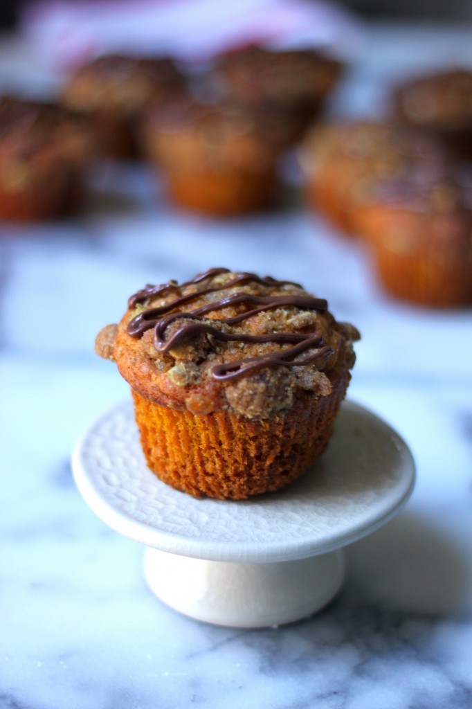 Pumpkin Banana Olive Oil Muffins with Crystalized Ginger Pepita Crumble and Nutella Drizzle