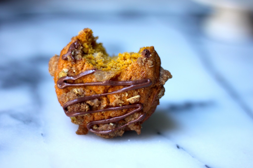 Pumpkin Banana Olive Oil Muffins with Crystalized Ginger Pepita Crumble and Nutella Drizzle