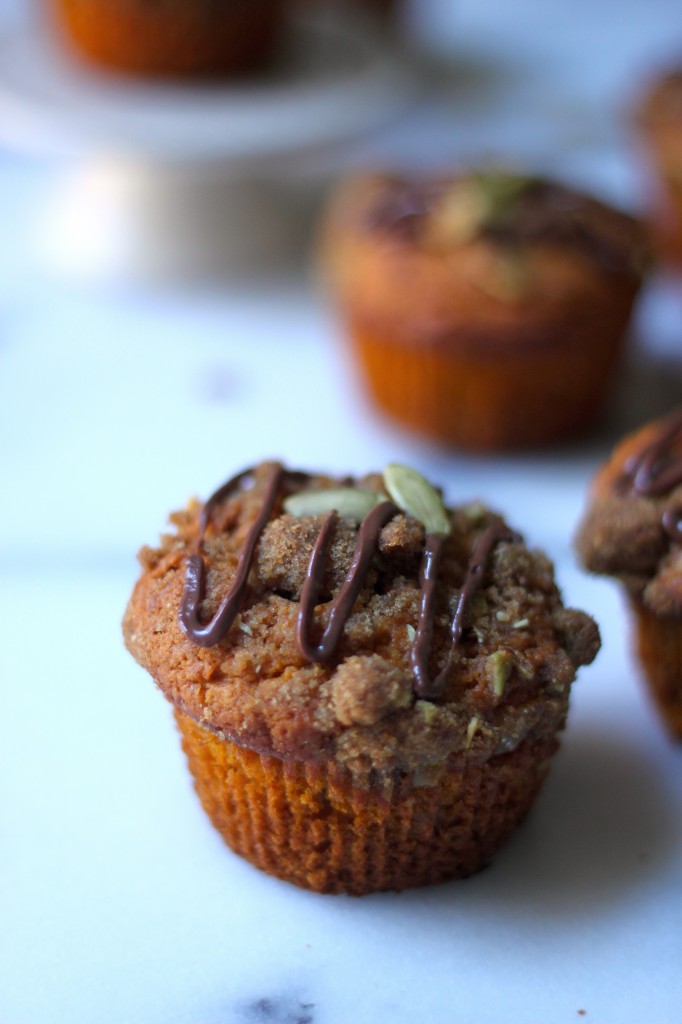 Pumpkin Banana Olive Oil Muffins with Crystalized Ginger Pepita Crumble and Nutella Drizzle