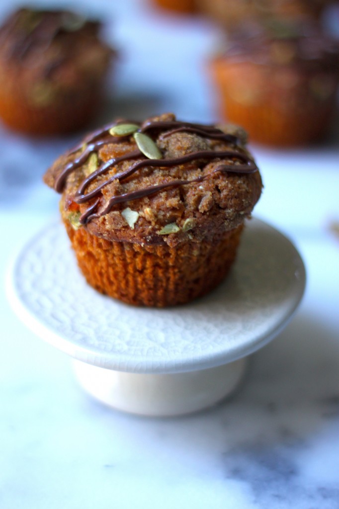 Pumpkin Banana Olive Oil Muffins with Crystalized Ginger Pepita Crumble and Nutella Drizzle