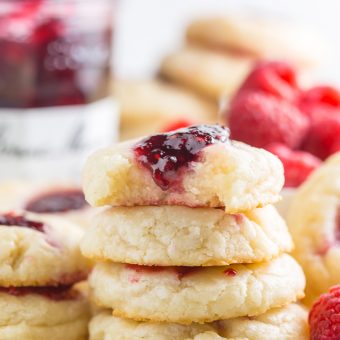 These 5-Ingredient Raspberry Cheesecake Thumbprint Cookies are so flavorful and basically melt in your mouth!!! An easy cookie recipe you'll make over and over again!