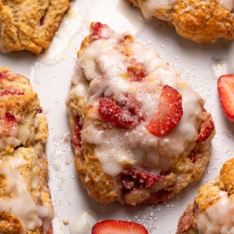 Fresh Strawberry Scones with Lemon Glaze are flaky and loaded with juicy strawberries! This is an easy breakfast the whole family will love! So good with a cup of tea or coffee!