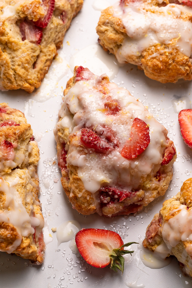 Fresh Strawberry Scones with Lemon Glaze are flaky and loaded with juicy strawberries! This is an easy breakfast the whole family will love! So good with a cup of tea or coffee!