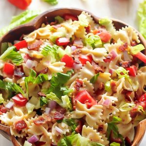 This 20-Minute BLT Easy Pasta Salad is fresh, fast, SUPER satisfying! This simple bow tie pasta salad is LOADED with bacon, lettuce, and tomato!!! And then it's dressed in a slightly creamy - and totally addicting - Zesty Italian dressing. 