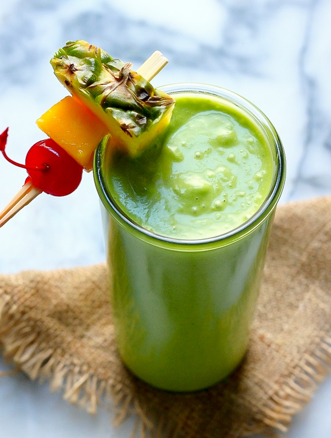 An Actually Delicious Tropical Green Smoothie - Baker by Nature