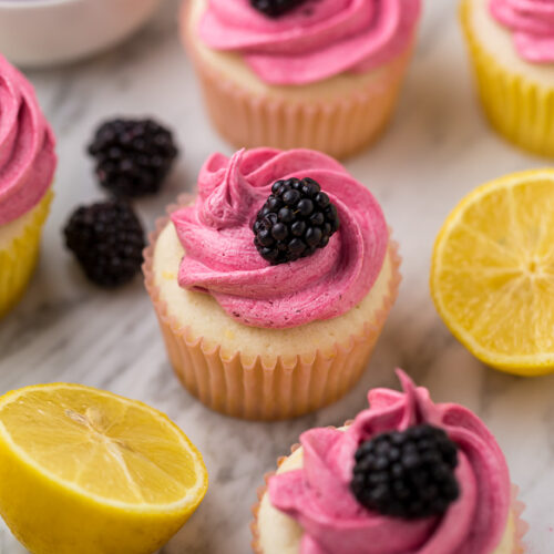 Fluffy Lemon Cupcakes are topped with BLACKBERRY Buttercream! These Lemon Blackberry Cupcakes are so pretty and always a showstopper. Their refreshing flavor makes them perfect for Spring and Summer celebrations! 