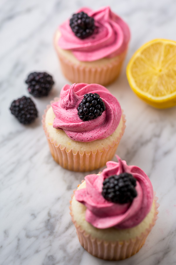 Fluffy Lemon Cupcakes are topped with BLACKBERRY Buttercream! These Lemon Blackberry Cupcakes are so pretty and always a showstopper. Their refreshing flavor makes them perfect for Spring and Summer celebrations! 