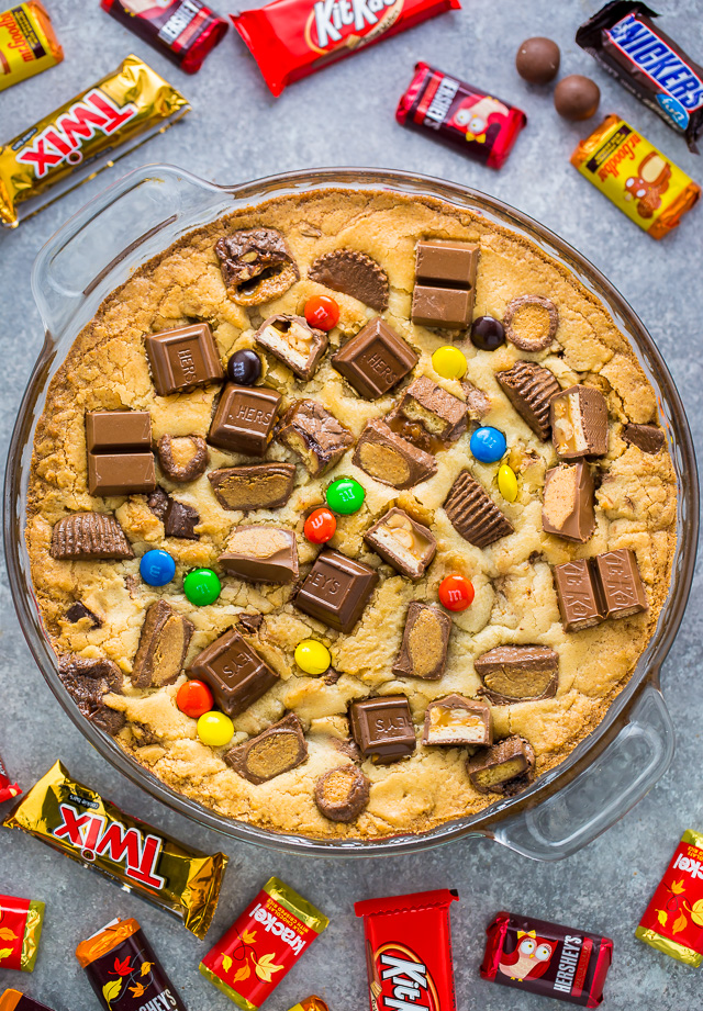 This easy to make Halloween Candy Cookie Cake is the perfect way to use up leftover candy! A hit with kids and adults!