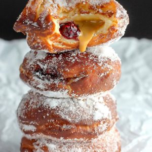 Bakery Style Peanut Butter and Jelly Doughnuts - Soft, fluffy, and stuffed with peanut butter and jelly - these bakery style doughnuts are a classic!