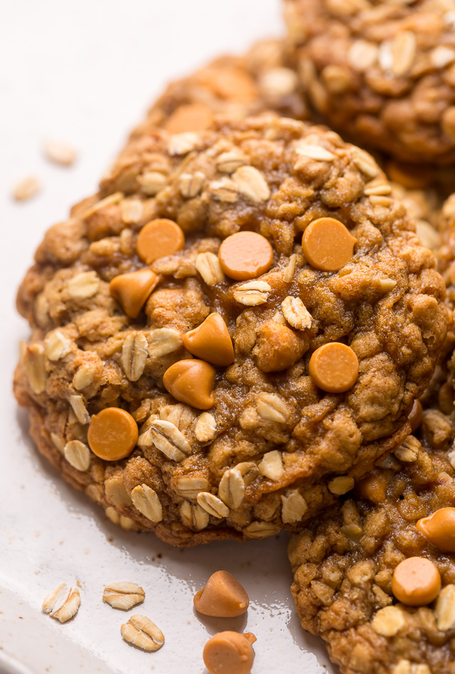 These delightfully soft and chewy oatmeal scotchies are exploding with oats and butterscotch chips! A touch of orange zest and a drizzle of molasses take this from a good recipe to a great recipe! No chilling required, so preheat your oven to 350 degrees and jump to the recipe!