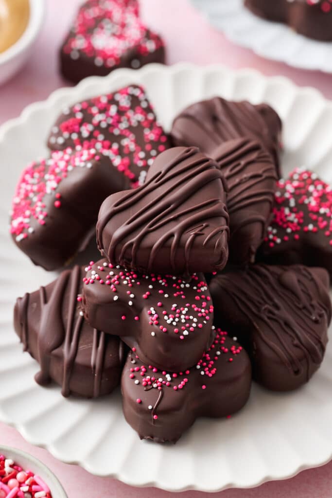 Peanut butter heart candies on a white plate. 