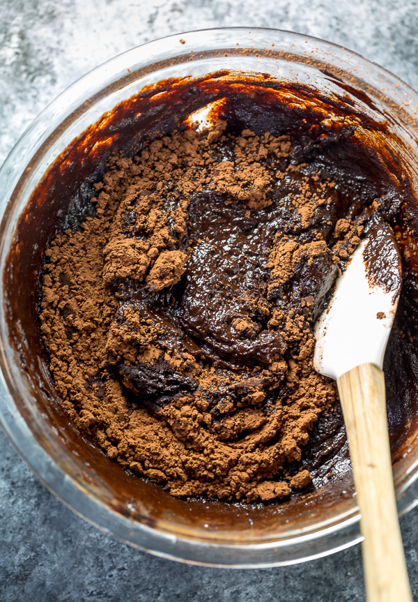 Chocolate Cookie Batter in glass bowl with spatula. 