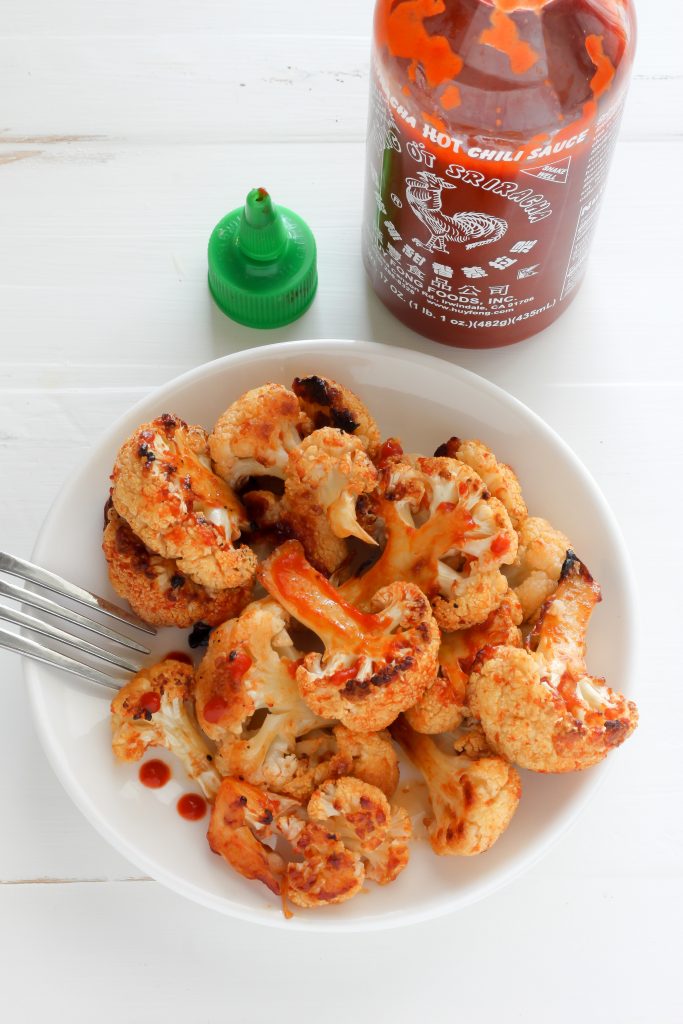 Maple Sriracha Roasted Cauliflower - my favorite way to eat cauliflower! Sweet, spicy, and SO delicious!