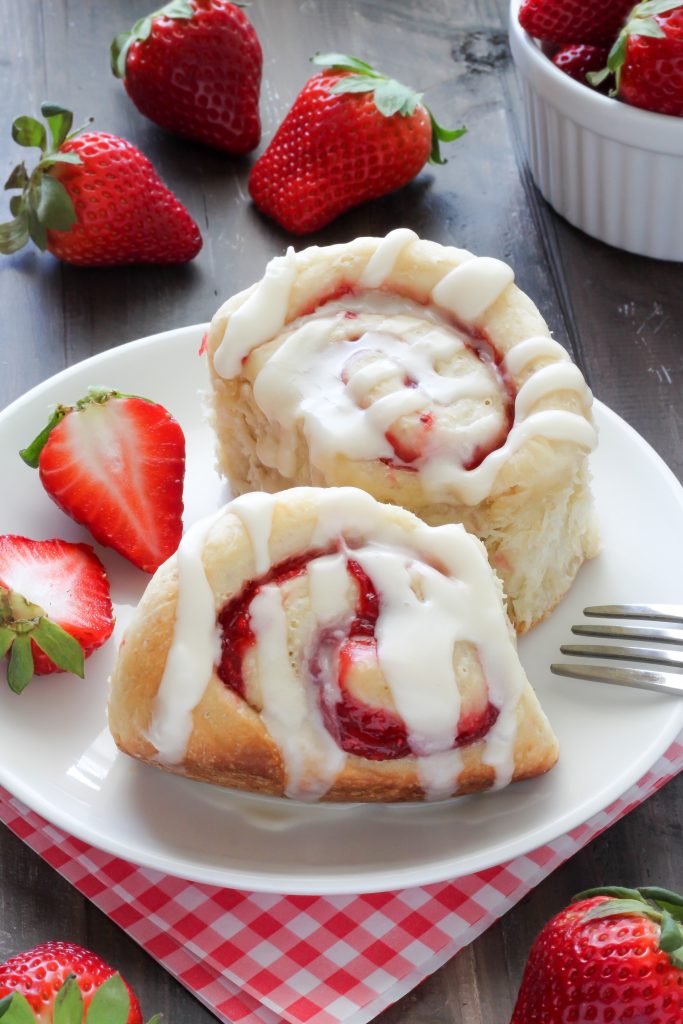 Strawberry Rolls with Vanilla Glaze - Soft, fluffy, and swirled with strawberry filling! The vanilla glaze is the perfect finish!