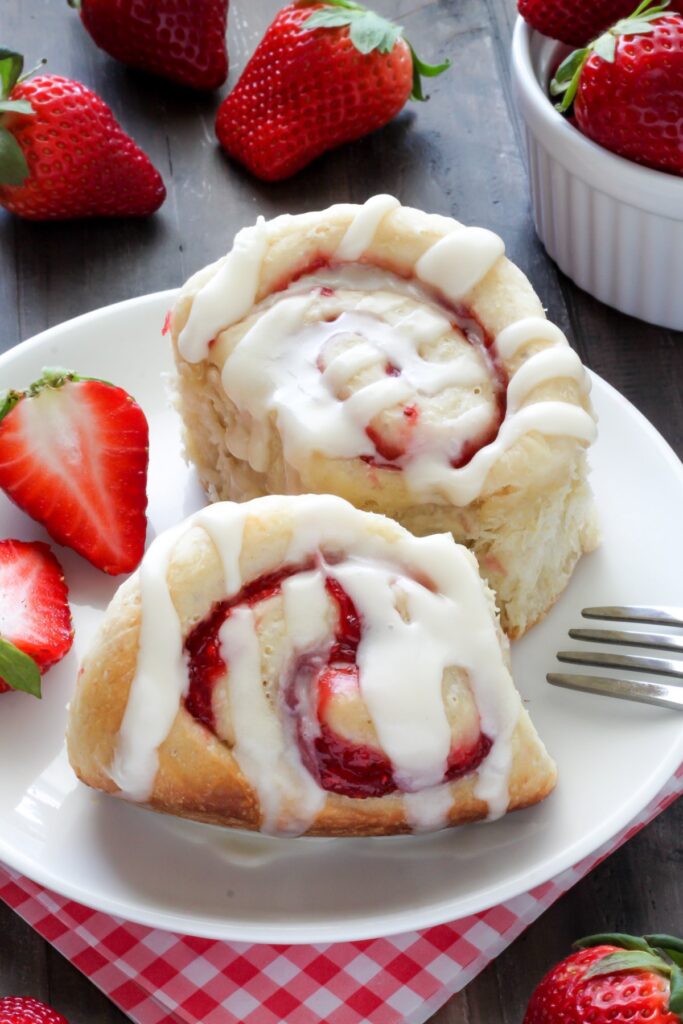 Strawberry Rolls with Vanilla Glaze - Soft, fluffy, and swirled with strawberry filling! The vanilla glaze is the perfect finish! 