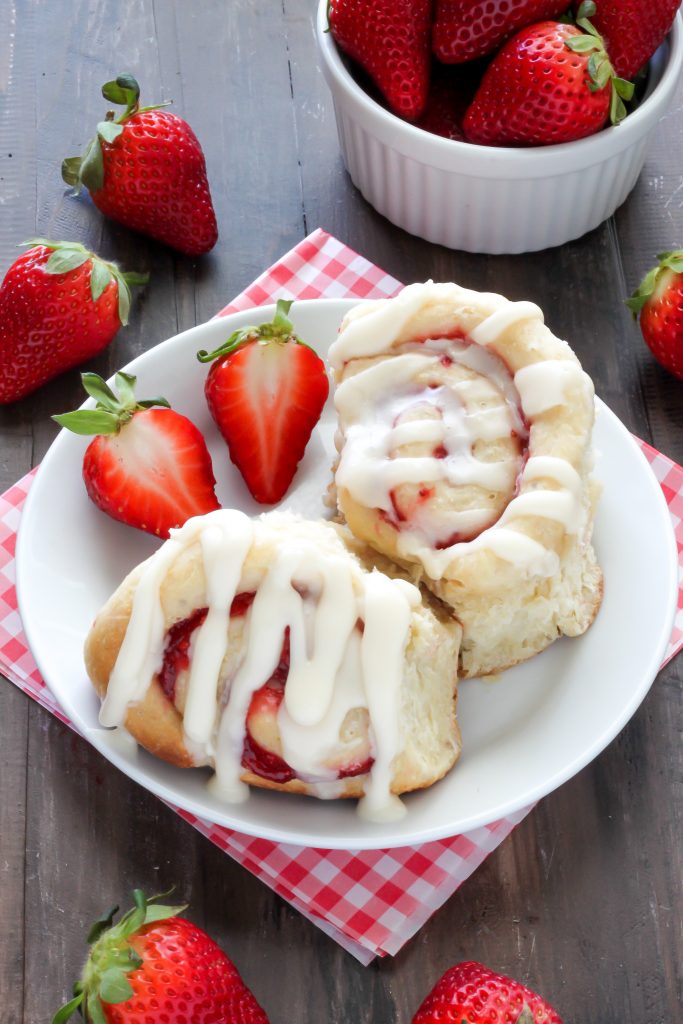 Strawberry Rolls with Vanilla Glaze - Soft, fluffy, and swirled with strawberry filling! The vanilla glaze is the perfect finish! 