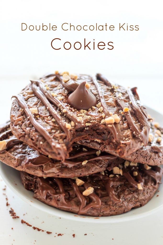 Double Chocolate Kiss Cookies - Thick and Chewy Double Chocolate Cookies are topped with a chocolate drizzle, toffee bits, and a chocolate kiss! A chocolate lovers dream.