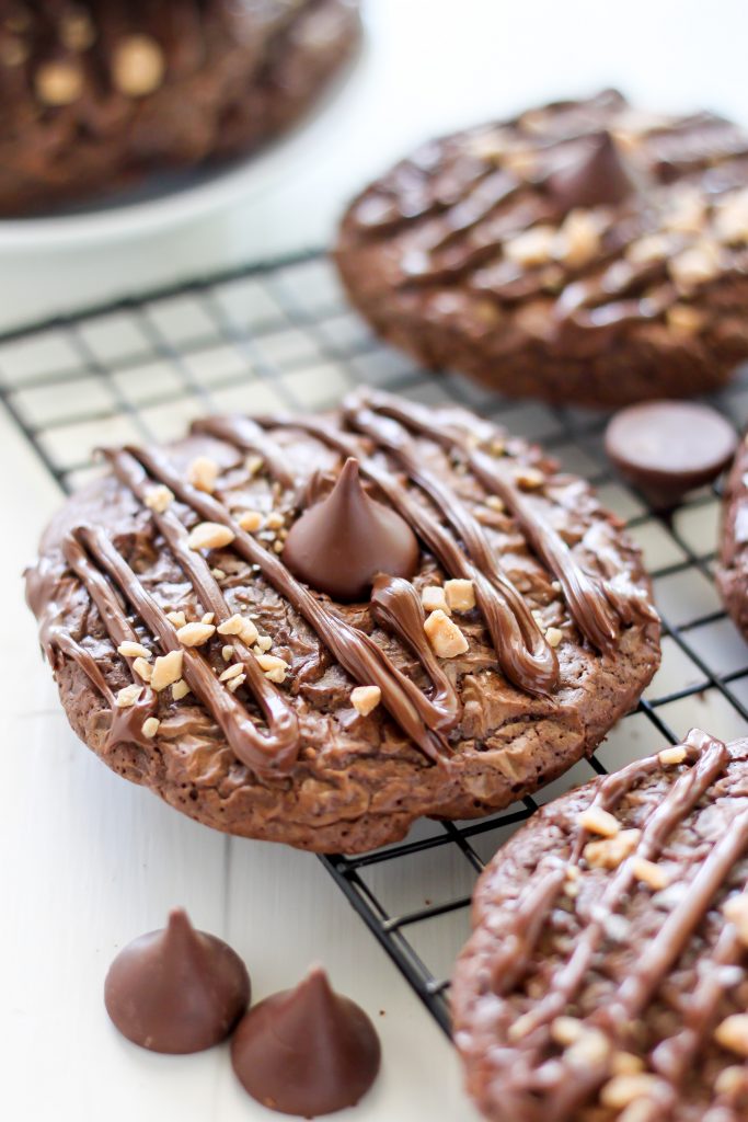 Double Chocolate Kiss Cookies - Thick and Chewy Double Chocolate Cookies are topped with a chocolate drizzle, toffee bits, and a chocolate kiss! A chocolate lovers dream.