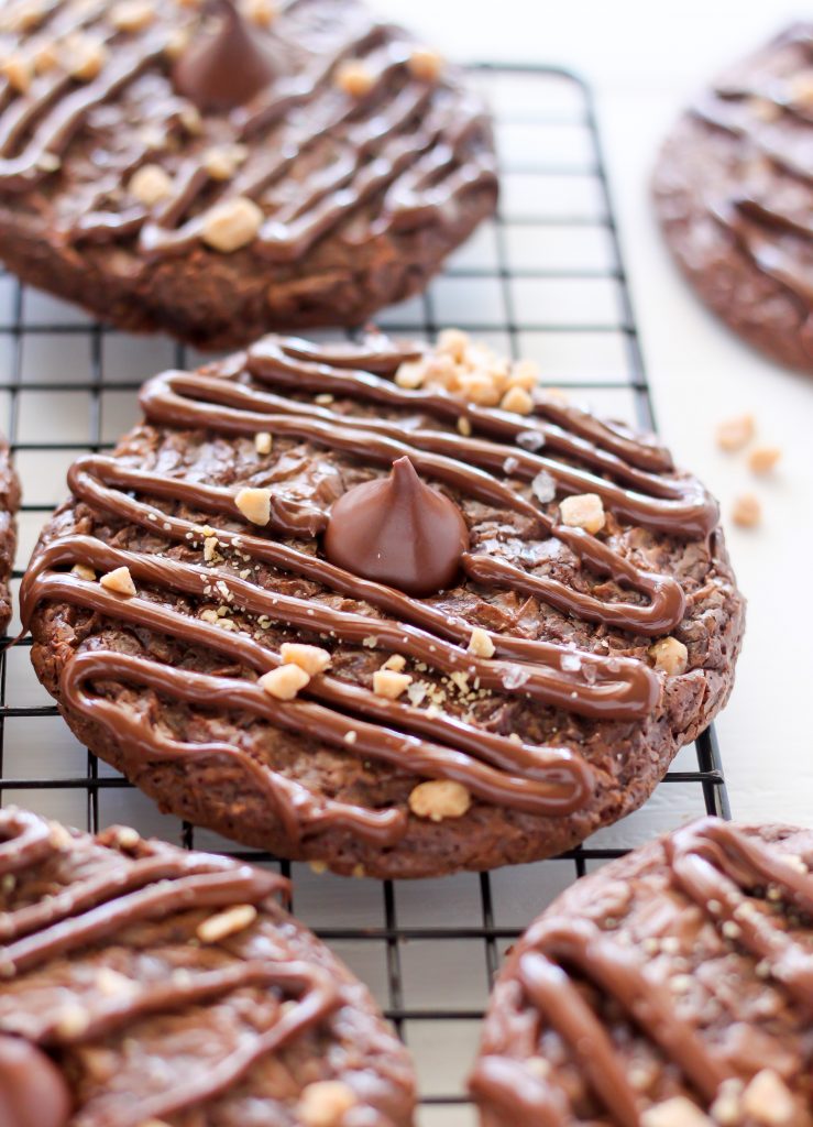 Double Chocolate Kiss Cookies - Thick and Chewy Double Chocolate Cookies are topped with a chocolate drizzle, toffee bits, and a chocolate kiss! A chocolate lovers dream.