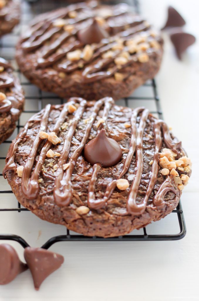 Double Chocolate Kiss Cookies - Thick and Chewy Double Chocolate Cookies are topped with a chocolate drizzle, toffee bits, and a chocolate kiss! A chocolate lovers dream.