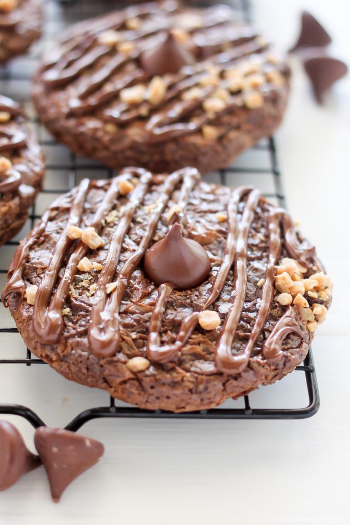 Double Chocolate Kiss Cookies - Thick and Chewy Double Chocolate Cookies are topped with a chocolate drizzle, toffee bits, and a chocolate kiss! A chocolate lovers dream.