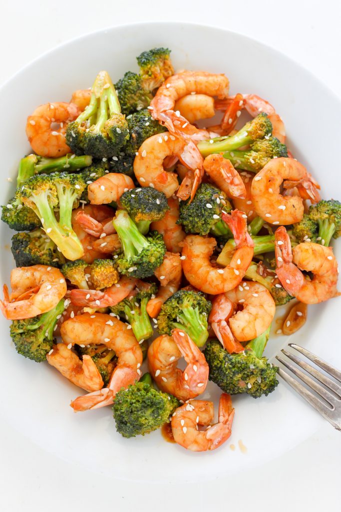 Spicy shrimp and broccoli stir-fry on a serving plate. 