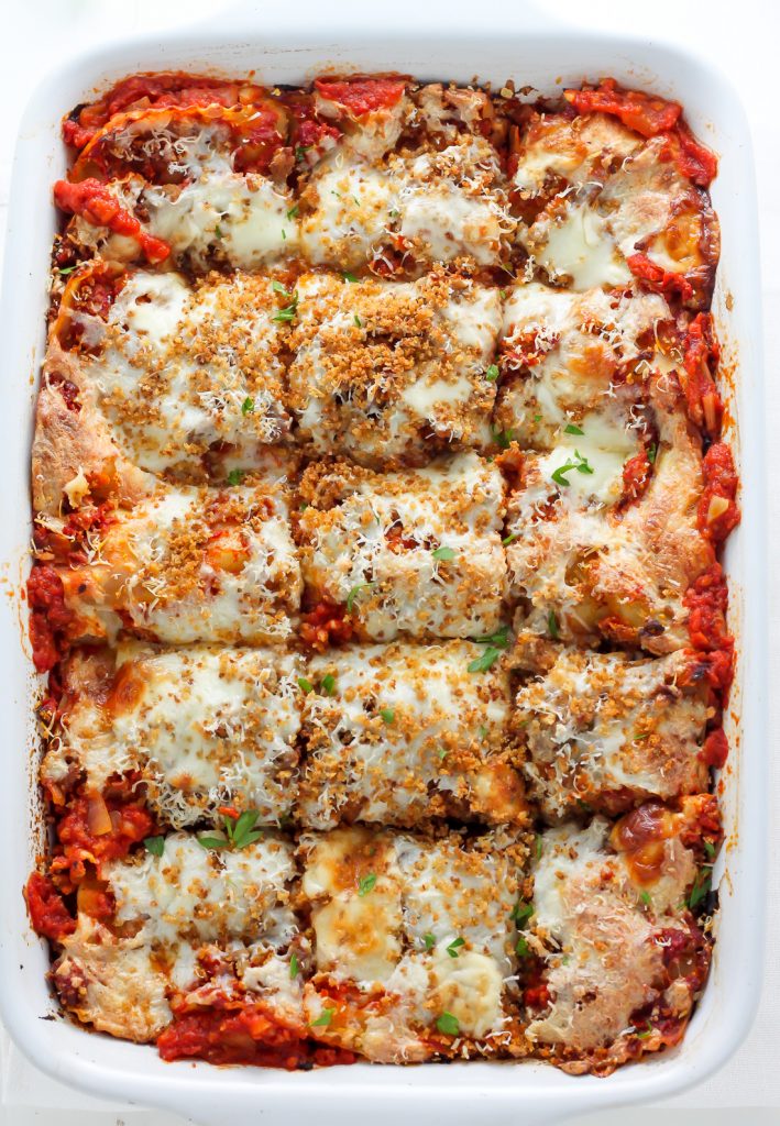 Lightened Up Chicken Parmesan Lasagna - layers of gooey cheese, chicken, sauce, and noodles! THIS IS AMAZING!