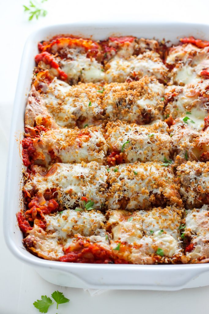 Lightened Up Chicken Parmesan Lasagna - layers of gooey cheese, chicken, sauce, and noodles! THIS IS AMAZING!