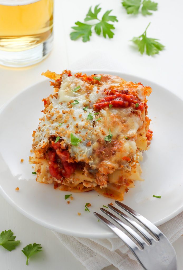 Lightened Up Chicken Parmesan Lasagna - layers of gooey cheese, chicken, sauce, and noodles! THIS IS AMAZING!