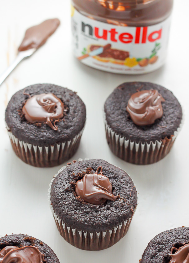 Decadent chocolate cupcakes stuffed with creamy nutella and topped with fresh raspberry frosting.