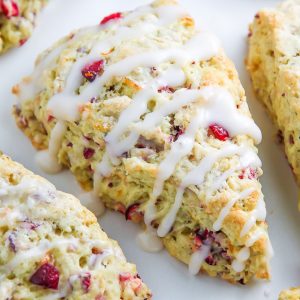 Homemade Cranberry Ricotta Scones feature supremely soft centers, crunchy tops, and a sweet orange glaze.