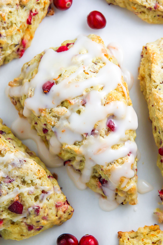 Homemade Cranberry Ricotta Scones feature supremely soft centers, crunchy tops, and a sweet orange glaze.