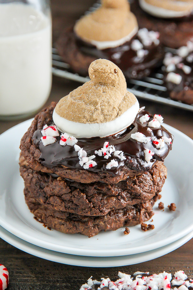 You're going to love these Peppermint Hot Chocolate Cookies! Topped with a drizzle of rich chocolate ganache, a sprinkle of crushed candy canes, and a hot cocoa and cream flavored peeps marshmallow.