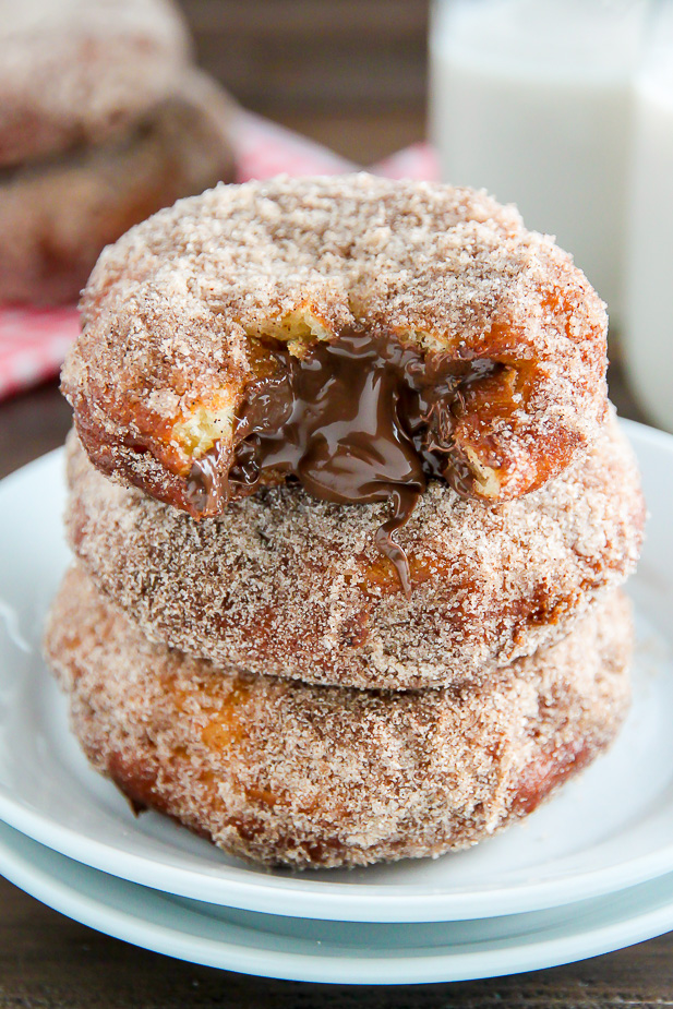 Homemade Cinnamon Sugar Doughnuts stuffed with a dollop of creamy Nutella. The definition of decadence!