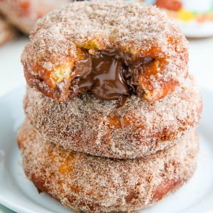 Homemade Cinnamon Sugar Doughnuts stuffed with a dollop of creamy Nutella. The definition of decadence!