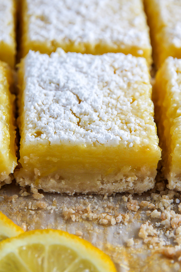 Sunny Lemon Squares feature a crunchy coconut crust, creamy lemon filling, and sprinkle of sweet sugar on top. YUM.