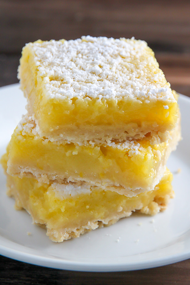 Sunny Lemon Squares feature a crunchy coconut crust, creamy lemon filling, and sprinkle of sweet sugar on top. YUM.