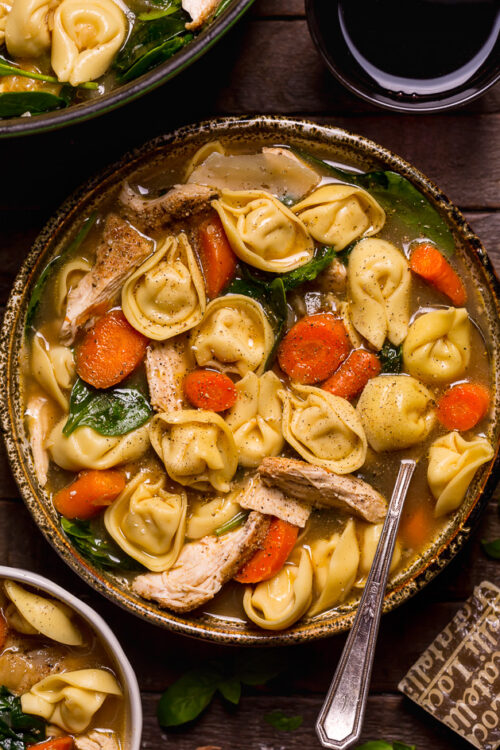 Nothing screams cozy like a giant bowl of Italian Chicken Tortellini Soup! Loaded with tender cheese tortellini, shredded chicken, fresh baby spinach, carrots, and celery... all in a super flavorful chicken broth! Serve this family favorite with extra parmesan cheese and crusty bread.