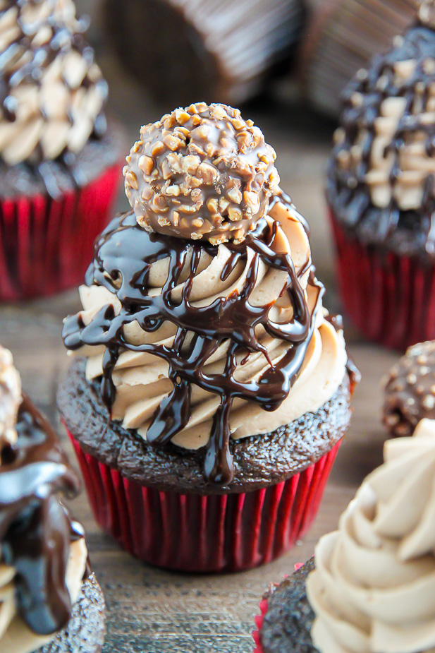 Triple Chocolate Nutella Cupcakes topped with silky chocolate ganache and a chocolate hazelnut truffle.