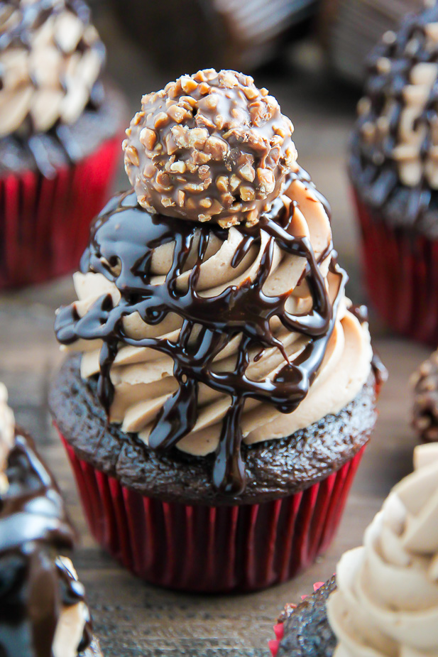 Triple Chocolate Nutella Cupcakes topped with silky chocolate ganache and a chocolate hazelnut truffle.