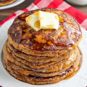 Moist and fluffy Gingerbread Pancakes made with whole wheat flour and a subtle amount of sugar! We love these.