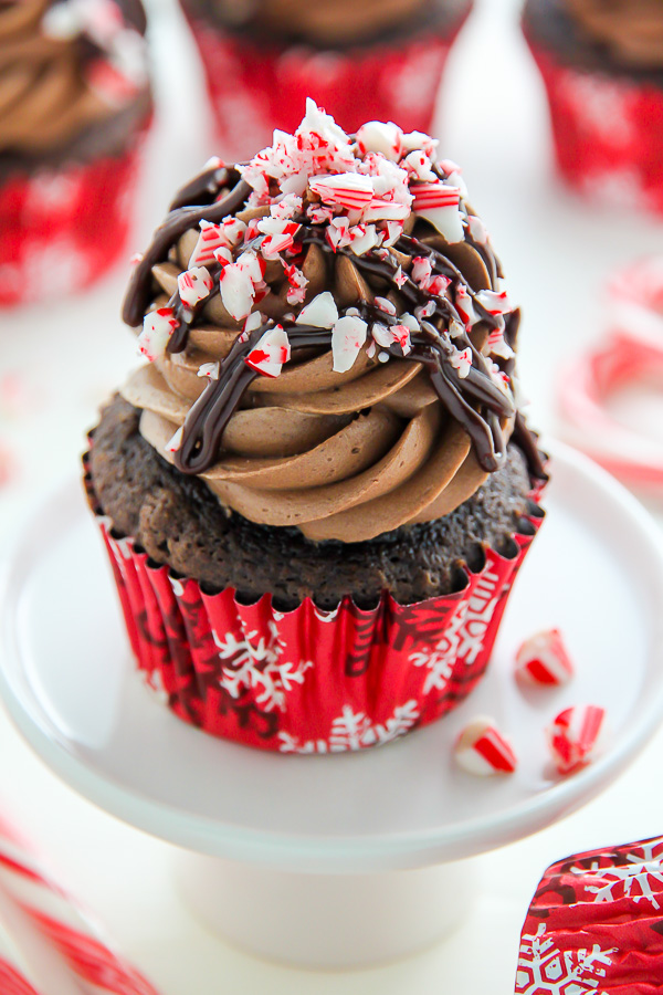 Supremely moist and decadent chocolate cupcakes topped with peppermint mocha frosting, a drizzle of chocolate ganache, and crushed candy canes.
