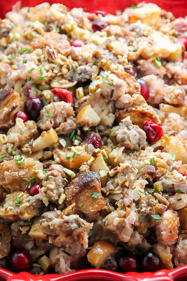 My go-to holiday stuffing recipe loaded with fresh herbs, chopped apples, cranberries, and sausage! Bonus: This recipe can be made ahead to help you save time.