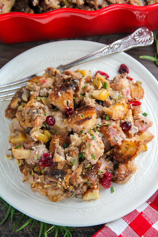 My go-to holiday stuffing recipe loaded with fresh herbs, chopped apples, cranberries, and sausage! Bonus: This recipe can be made ahead to help you save time.