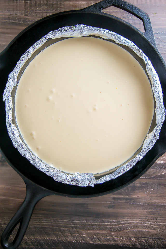 Supremely smooth and creamy homemade Lemon cheesecake topped with fresh Blueberry swirls. All layered on top of a buttery homemade graham cracker crust. 