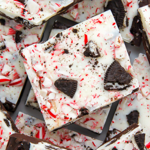 Layered peppermint chocolate bark topped with crushed candy canes and Oreo cookies!