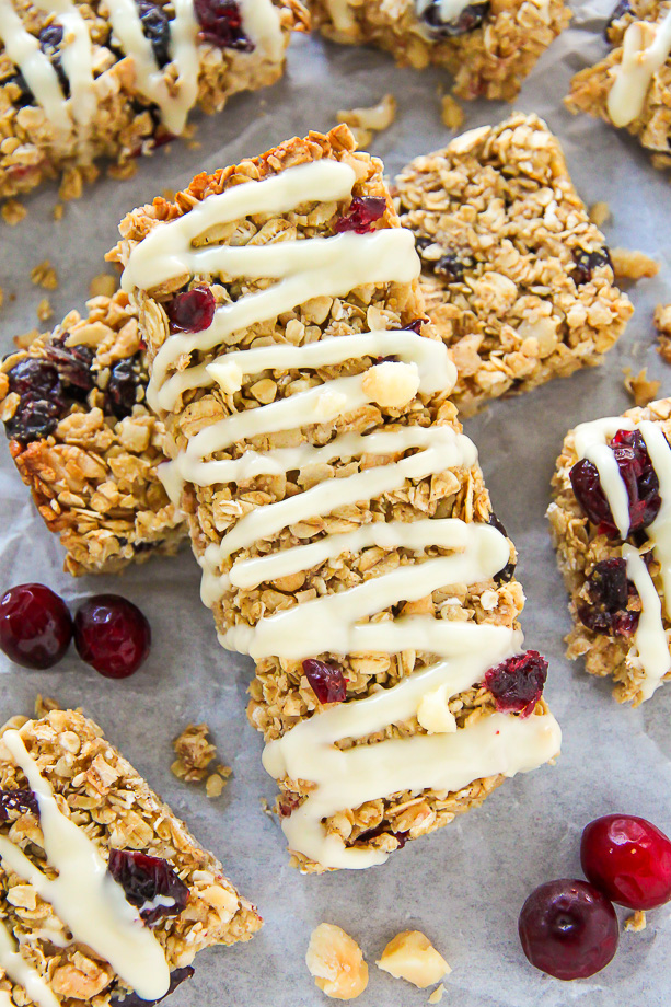 Loaded with cranberries, macadamia nuts, and topped with a sweet drizzle of white chocolate. These homemade granola bars are as easy as they are irresistible!